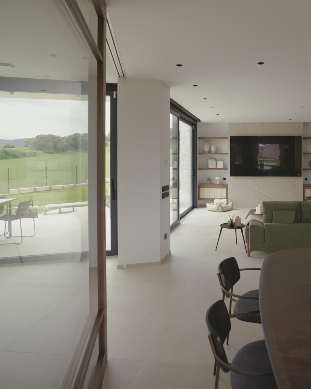 Interior de arquitectura moderna de obra nueva en Casa V por a.bolado arquitectura, donde destaca la sencillez material de la piedra y la búsqueda de paz y luz
